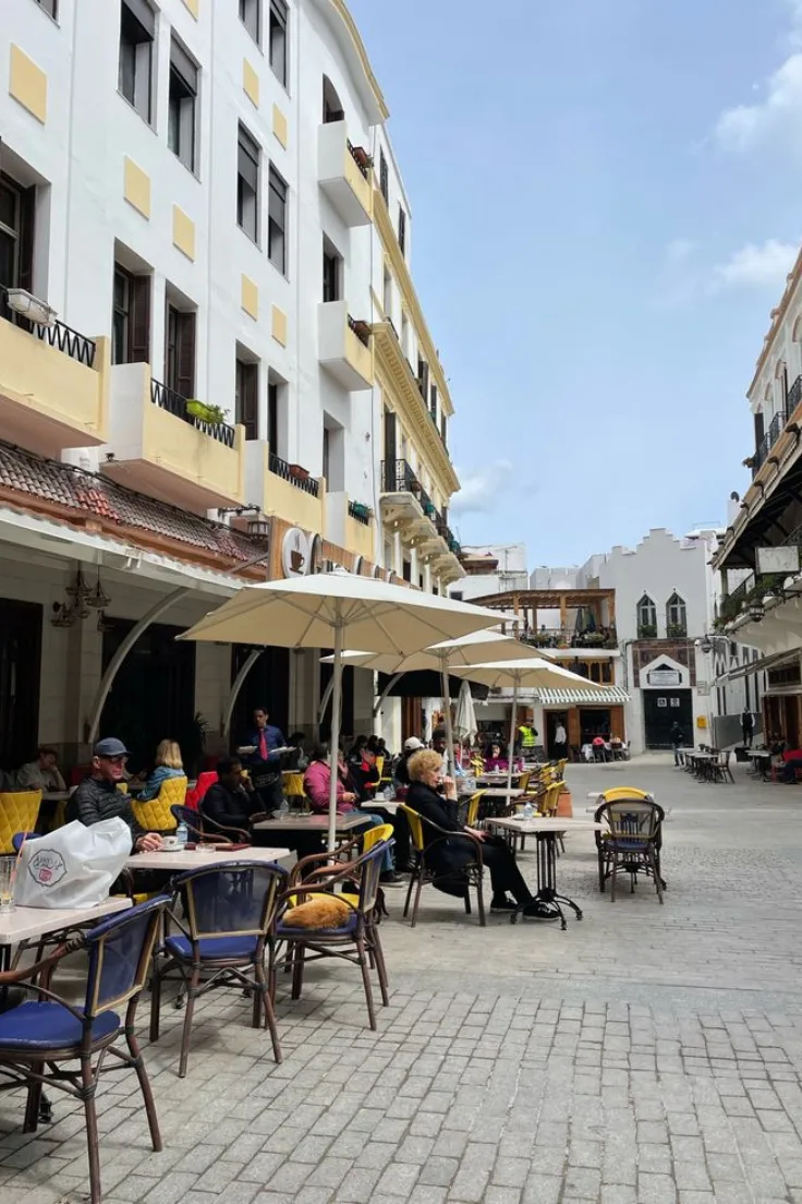 Cafe terrace with white umbrellas in the Tangier Kasbah