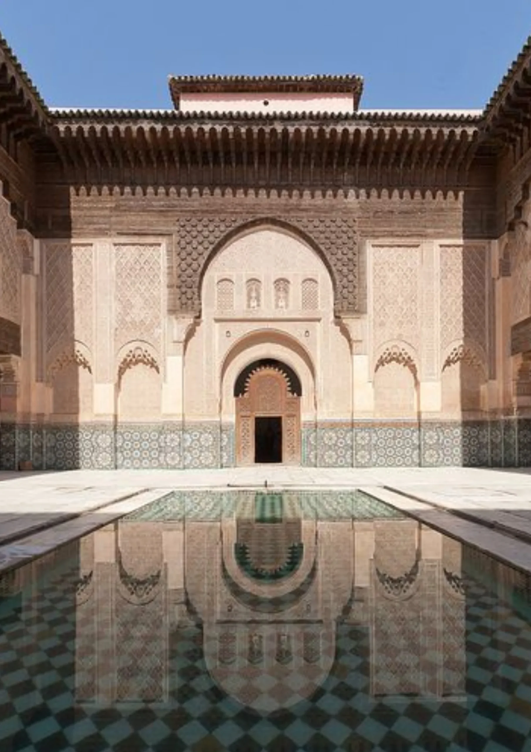 Carved plaster and tilework courtyard of the Bou Inania Madrasa in Fes