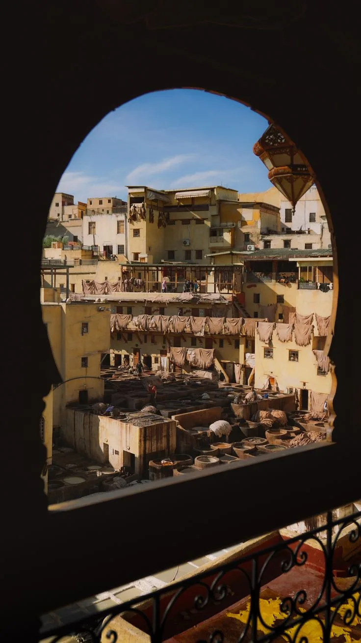 View of the Fes tanneries framed by a stone archway
