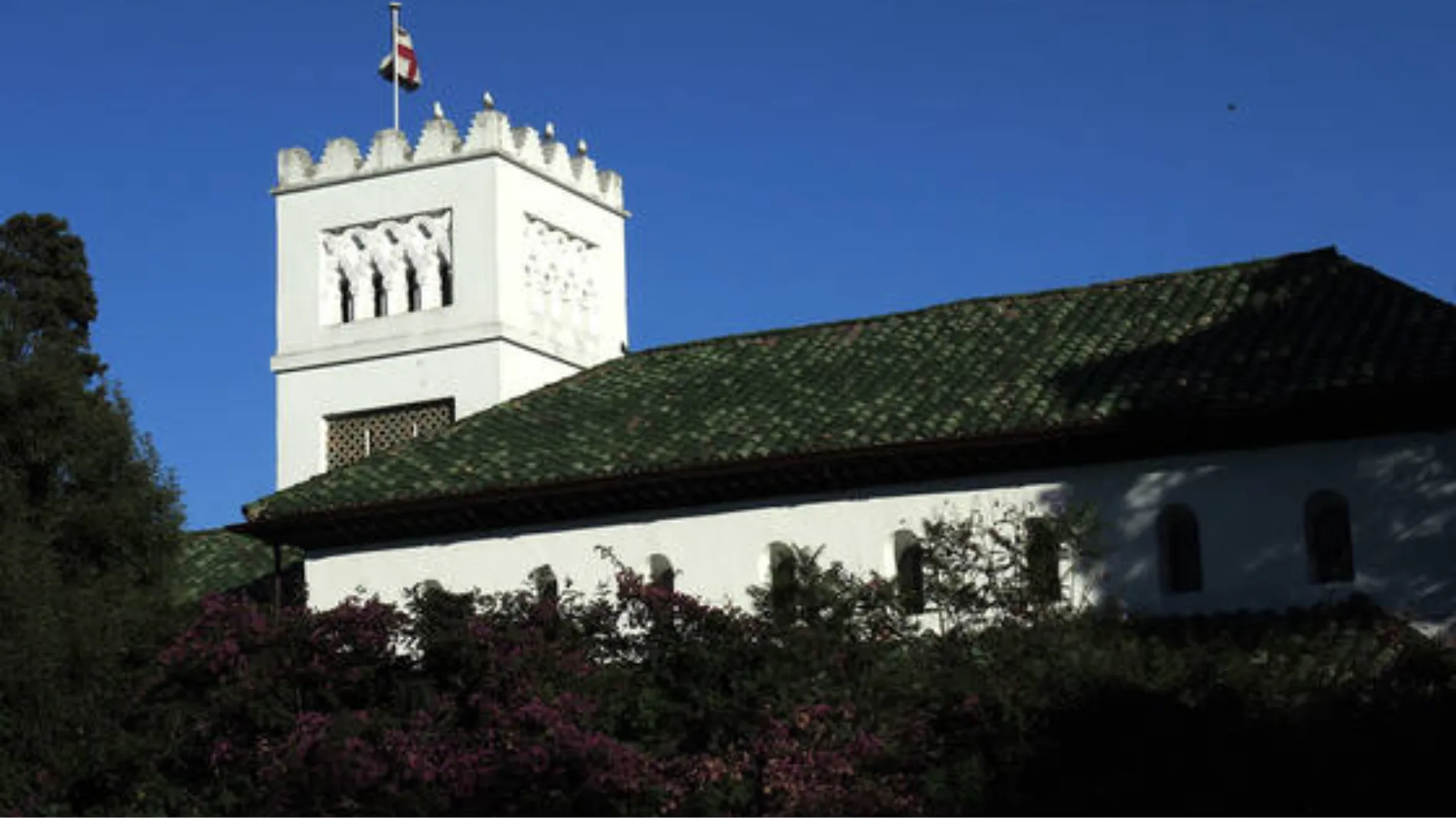 Saint Andrew's Church in Tangier with its white crenellated tower and green tiled roof