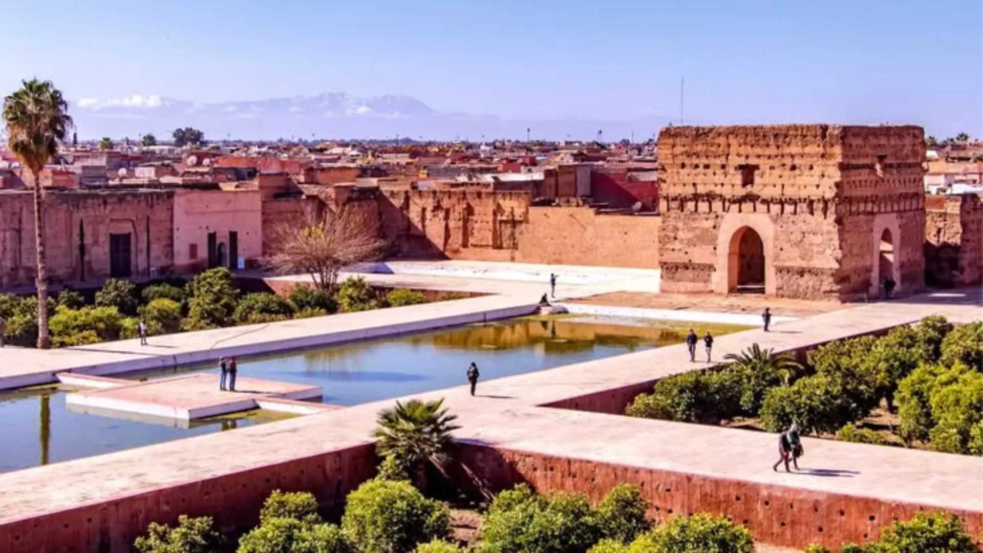 Sunken garden pools and red-stone ruins of El Badi Palace in Marrakech