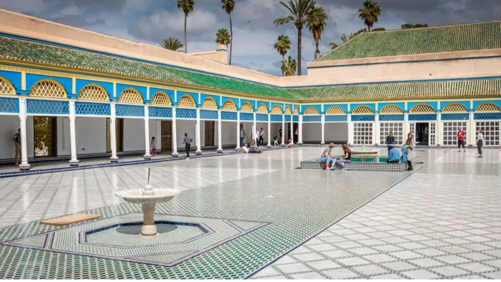 Tiled courtyard with a fountain and colonnade at Bahia Palace in Marrakech