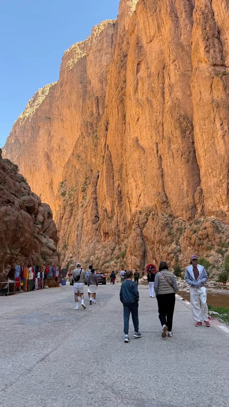 Visitors walking through Todgha Gorge in the High Atlas on the way to the Sahara